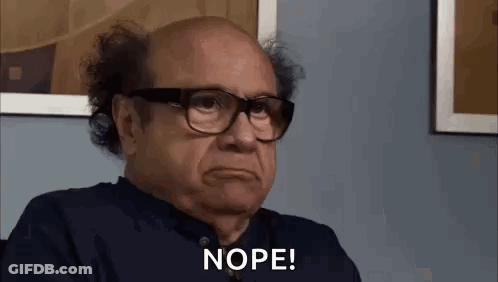 Woman In Green Shirt With Nope On Face GIF