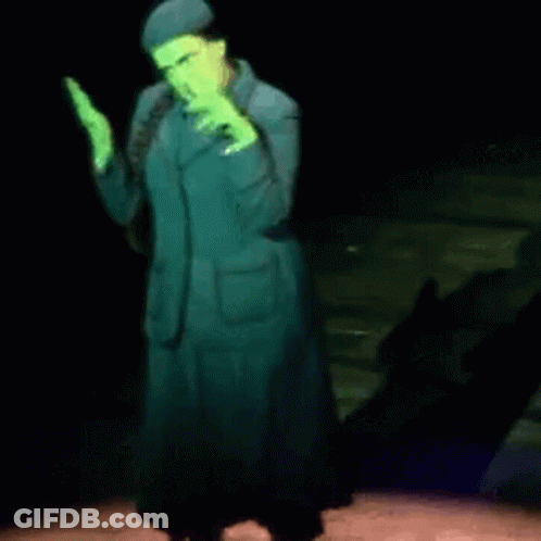 Woman In Green Suit Dancing On Stage GIF