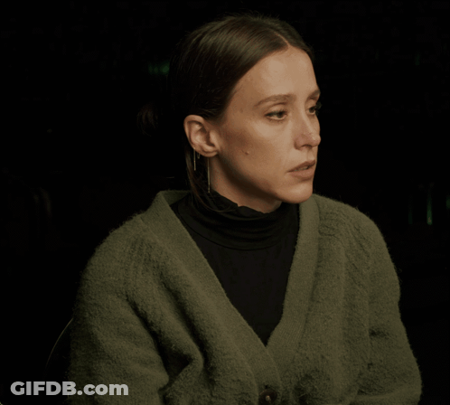 Woman In Green Sweater And Black Turtleneck GIF