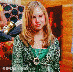 Woman In Green Sweater And Circle Necklace GIF