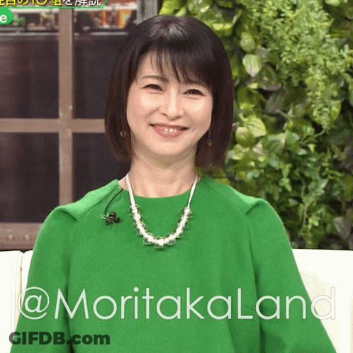 Woman In Green Sweater And Pearls On Couch @Moritakalana GIF