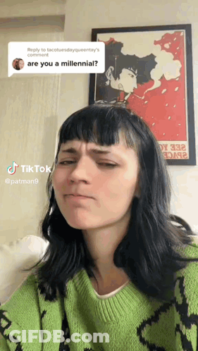 Woman In Green Sweater Making Funny Face GIF