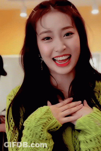 Woman In Green Sweater Smiling With Red Lipstick GIF