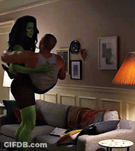 Woman In Green Tights Carrying Man GIF
