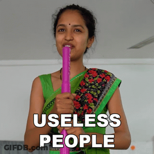 Woman In Green Top Holding Pink Stick Saying Useless People GIF