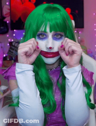 Woman In Green Wig And White Gloves Joker GIF
