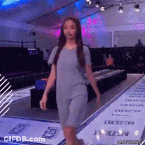 Woman In Grey Dress Walking Runway GIF