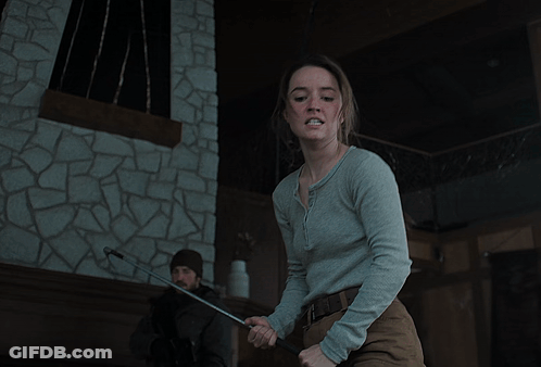 Woman In Grey Shirt Making A Face GIF