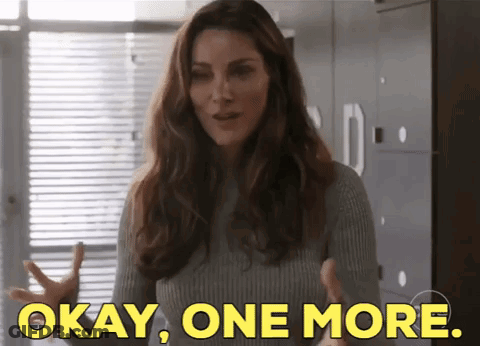 Woman In Grey Sweater Saying Okay GIF