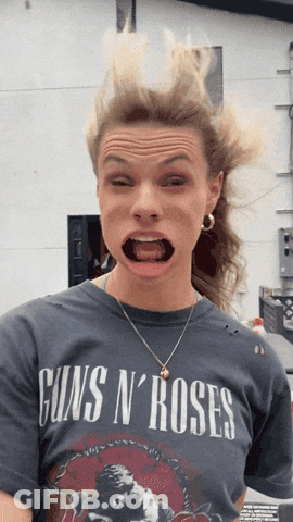 Woman In Guns N Roses T-Shirt Making Funny Face GIF