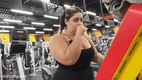 Woman In Gym With A & S Sign GIF