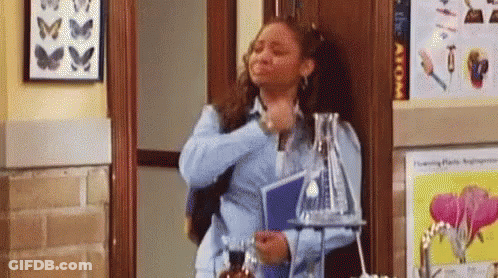Woman In Hallway With Beaker And Book GIF