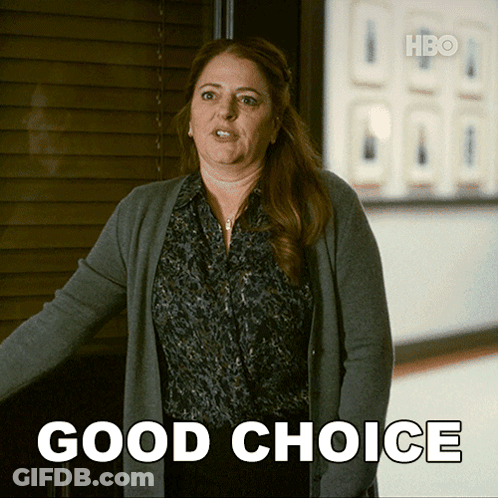 Woman In Hallway With Good Choice Sign GIF