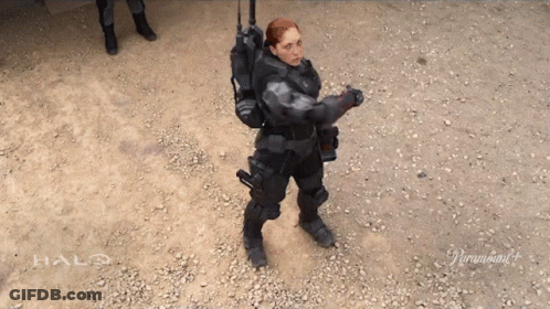 Woman In Halo Costume Standing On Gravel GIF