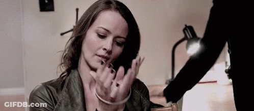 Woman In Handcuffs Being Held GIF