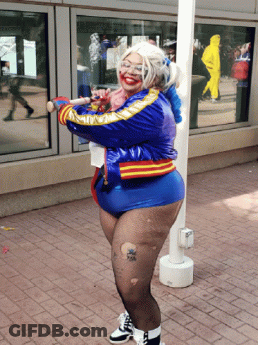 Woman In Harley Quinn Costume Holding Baseball Bat GIF