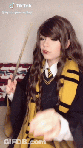 Woman In Harry Potter Costume Holding Wand And TikTok Sticker GIF