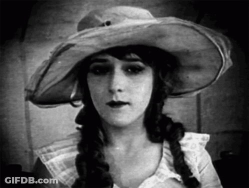 Woman In Hat And Braids Black And White GIF
