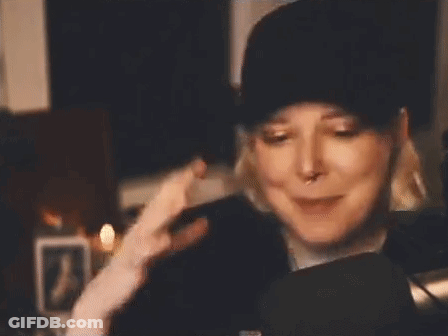 Woman In Hat And Headphones Making Funny Face GIF
