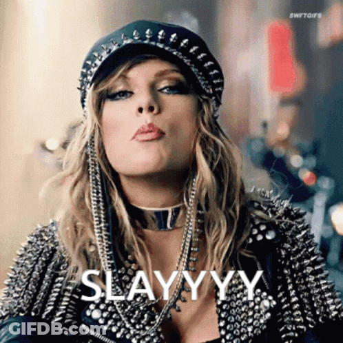 Woman In Hat And Leather Jacket Blowing A Kiss Saying Slayyyy GIF