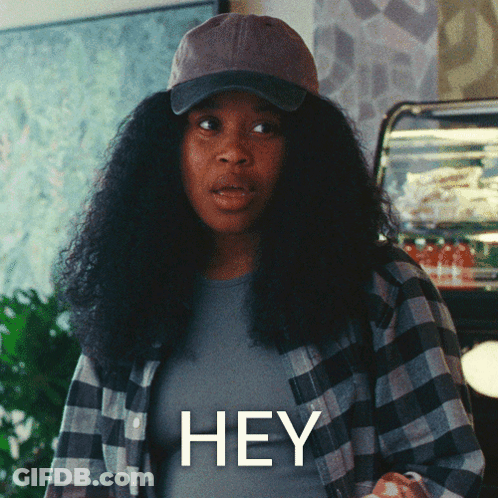 Woman In Hat And Plaid Shirt Saying Hey GIF