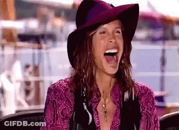 Woman In Hat And Purple Shirt Laughing GIF