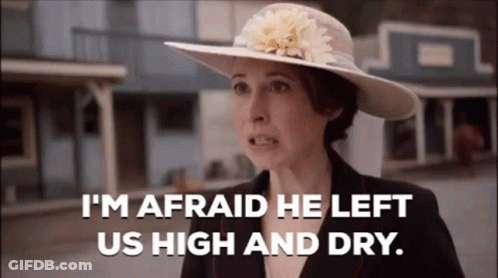 Woman In Hat And Suit Says I'm Afraid He Left Us High And Dry GIF