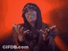 Woman In Hat And Sunglasses Making Funny Face With Hands Up GIF