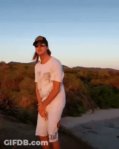 Woman In Hat And Sunglasses On Dirt Road GIF