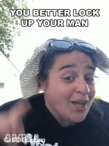 Woman In Hat And Sunglasses Saying You Better Lock Up Your Man GIF