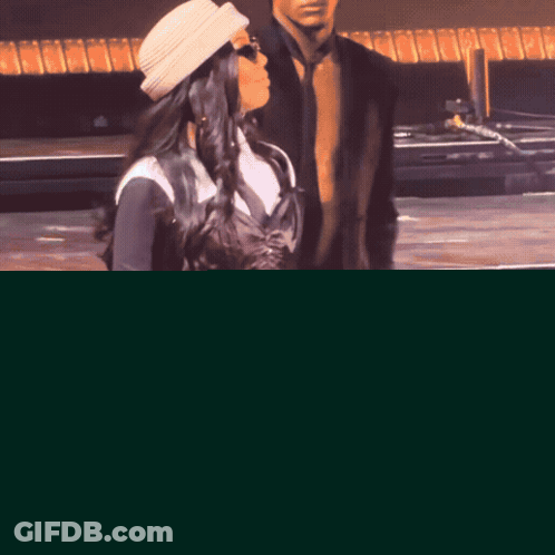 Woman In Hat And Sunglasses Singing GIF