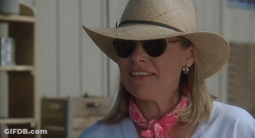 Woman In Hat And Sunglasses Smiling GIF