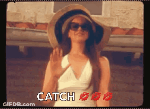 Woman In Hat And Sunglasses With Red Lipstick Says Catch GIF