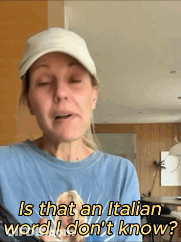 Woman In Hat Asks Is That Italian Word GIF