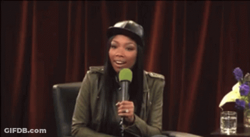 Woman In Hat Holding Microphone GIF
