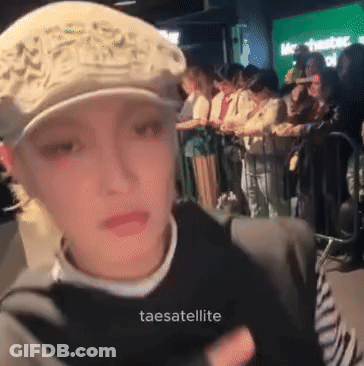 Woman In Hat In Front Of Crowd Taesatelite GIF