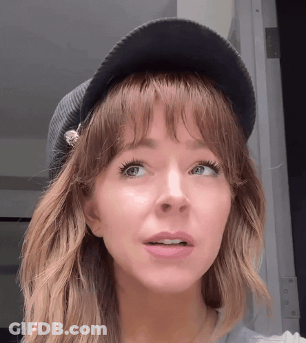 Woman In Hat Making Funny Face GIF