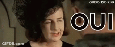 Woman In Hat Making Funny Face Oui GIF