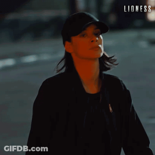 Woman In Hat Saying Lioness GIF