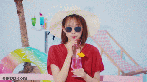 Woman In Hat Sunglasses Drinking Pink Glass GIF