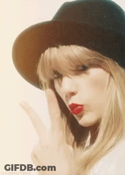 Woman In Hat With Red Lipstick Making Peace Sign GIF