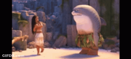 Woman In Hawaiian Outfit Next To Stuffed Dolphin GIF