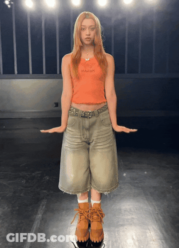 Woman In Hawaiian Shorts And Tank Top GIF