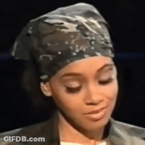Woman In Head Scarf And Jacket Close Up GIF