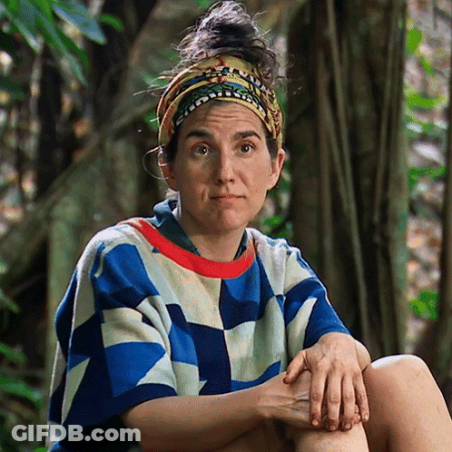 Woman In Headband And Colorful Shirt Hands On Knees GIF
