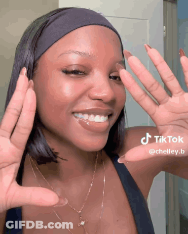 Woman In Headband And Necklace Making TikTok GIF