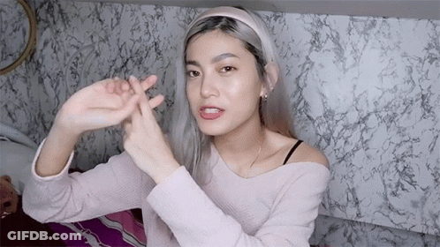 Woman In Headband Making Peace Sign GIF