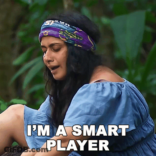 Woman In Headband Says I'm A Smart Player Sitting On Log GIF