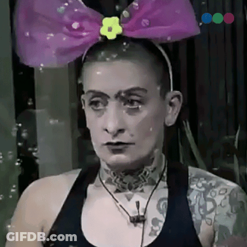 Woman In Headband With Purple Bow And Yellow Flower GIF