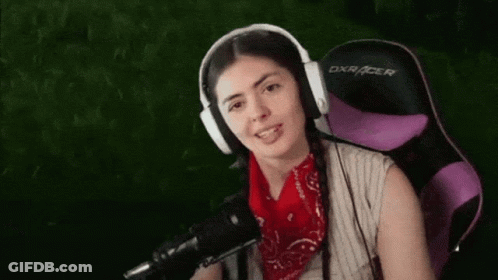 Woman In Headphones And Bandana Sitting In Purple Chair GIF
